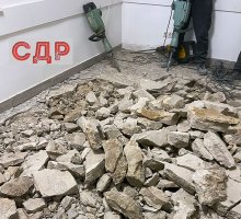 Демонтаж стяжки бетонного пола в офисе в Москве.